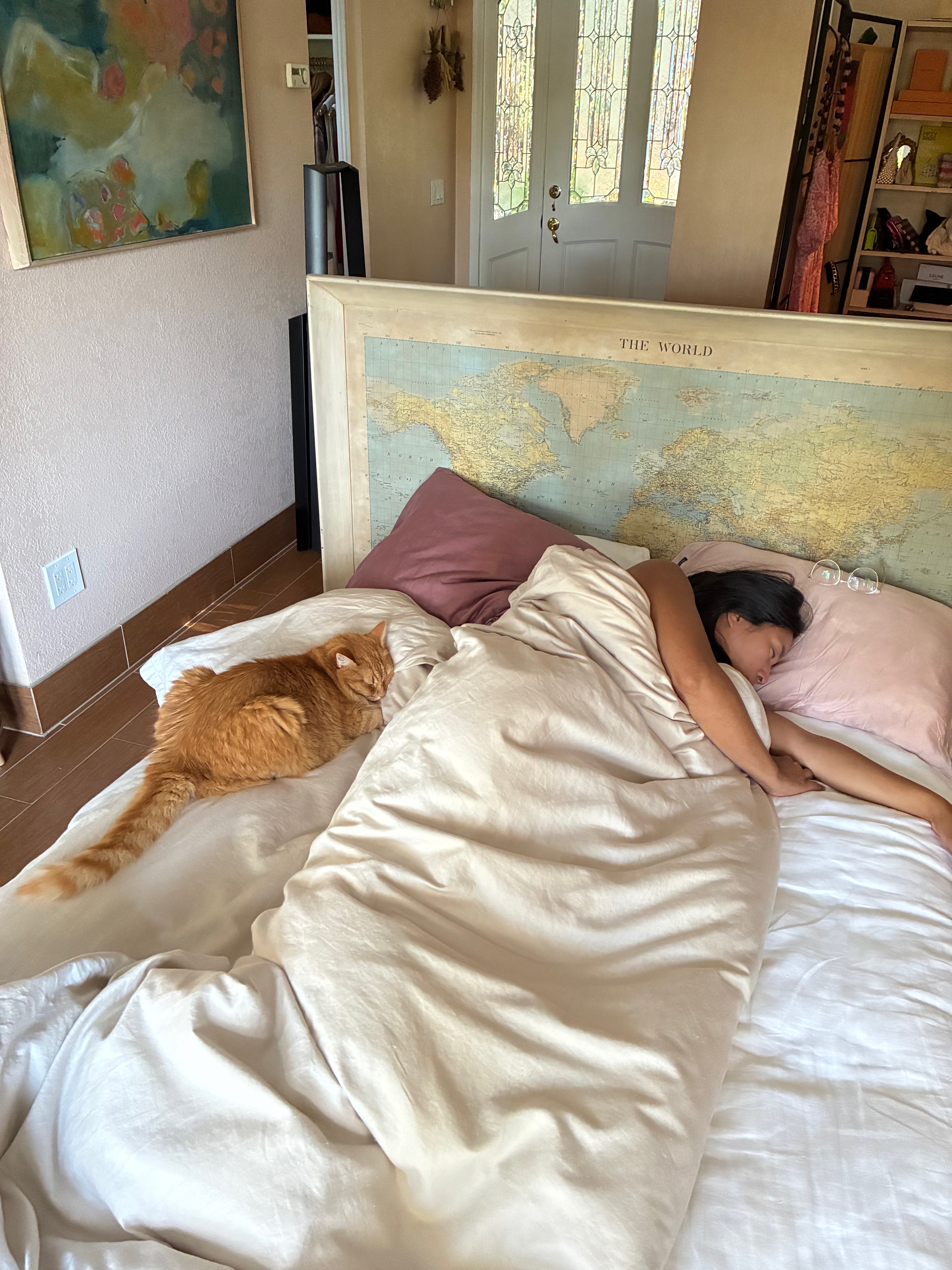 Nica and Santi sleeping on the bed